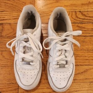 Nike kids Air Force ones size 5.5y equivalent to a woman size 7